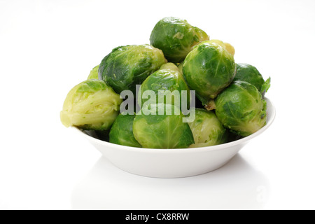 roasted brussels sprouts on a white plate, studio isolated Stock Photo