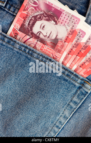 Fifty pound notes sterling in jeans back pocket Stock Photo