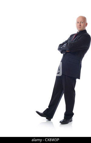 Man in suit leaning against something isolated on white Stock Photo