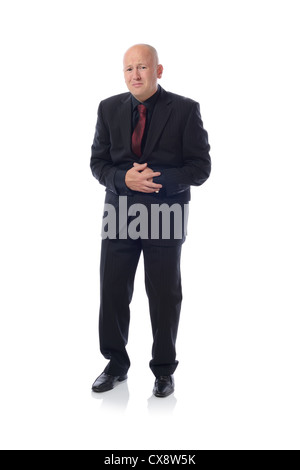 Businessman holding his stomach in pain or indigestion Stock Photo