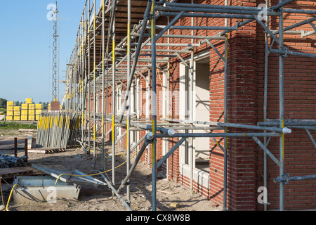 Construction site with family houses in scaffolding Stock Photo