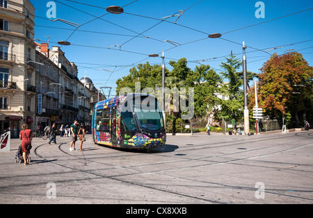 Modern tram travelling by Square Planchon in Montpellier operated by the Transports de l'agglomération de Montpellier TAM. Stock Photo