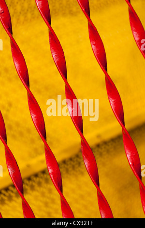 Red Twisted Iron Fence close up Stock Photo