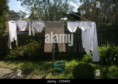 Laundry drying on a Hills Hoist in Australia Stock Photo