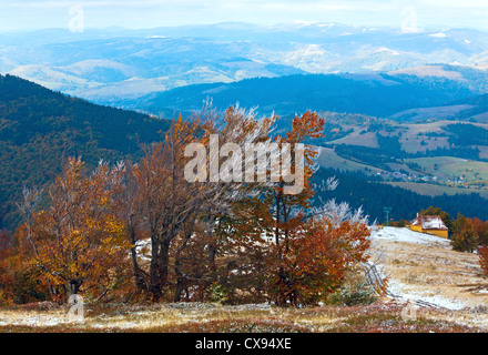 October Carpathian mountain Borghava plateau with first winter snow and autumn colourful foliage Stock Photo