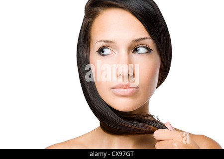 Closeup portrait of a brunette beauty with shiny healthy hair. Stock Photo