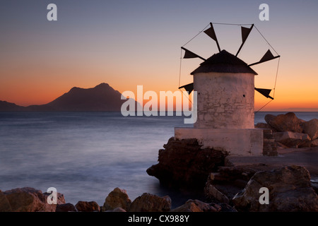 Windmill on Aigiali Harbour on Amorgos island in Greece Stock Photo