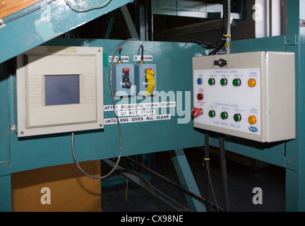 Packet Storage Conveyor 3 phase control panel. electrical installation 415 volts supply with warning label, Post office conveyor Stock Photo