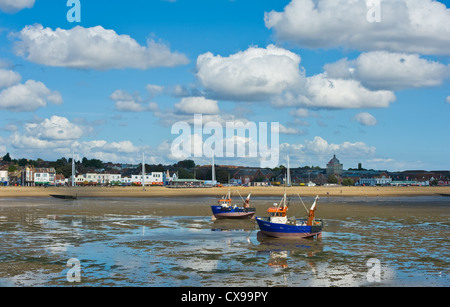 Two fishing boats anchored at low tide at Southend on Sea. Stock Photo
