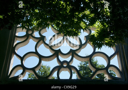 Concrete Chinese lattice window in Dr. Sun Yat-Sen Park, Chinatown, Vancouver, British Columbia, Canada Stock Photo