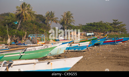 Colourful traditional fishing boats on a beach, Dili, East Timor Stock Photo