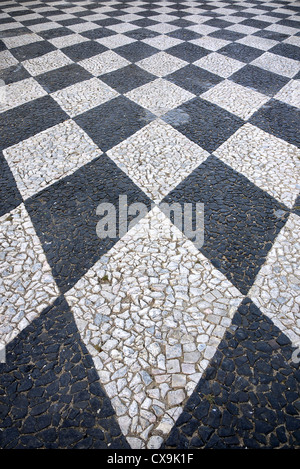 Black and white chequered paving in Tomar, Portugal. Stock Photo
