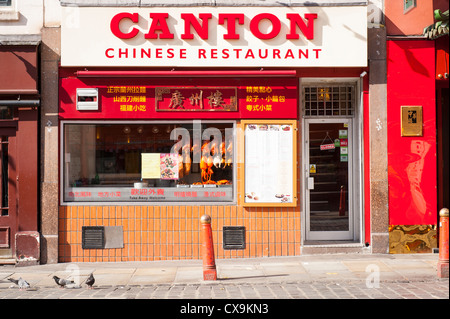 London West End Chinatown Newport Place Canton Chinese restaurant cafe snack bar display duck pork chicken squid hanging in window street scene Stock Photo