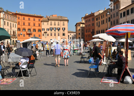 Rome, Italy - 29 March, 2012: Tourists walking in Piazza Navona, major touristic landmark in the historical centre of Rome Stock Photo