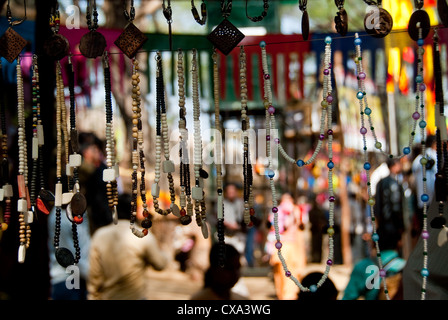 Colorful beads, hanging from overheard, for sale at the Surajkund Mela, which is held every February in Haryana in Delhi. Stock Photo