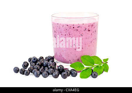 The glass of milkshake, berries and green sprig of blueberries isolated on white background Stock Photo