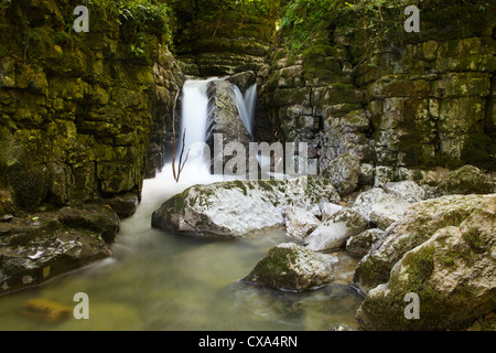 Waterfall in limestone gully at The Howk, Caldbeck, Lake District ...