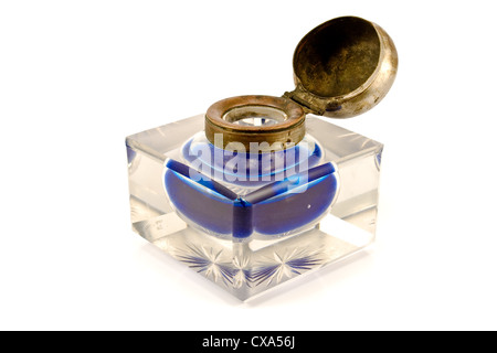 Antique inkwell with blue ink isolated on white Stock Photo