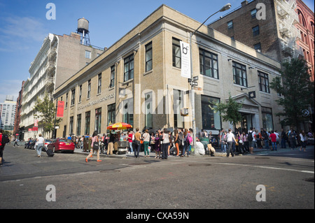Lines and crowds outside the Apple store in Soho in New York Stock Photo