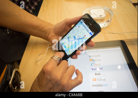 A consumer tries a new iPhone 5 in an Apple store in Soho in New York Stock Photo