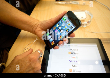 A consumer tries a new iPhone 5 in an Apple store in Soho in New York Stock Photo