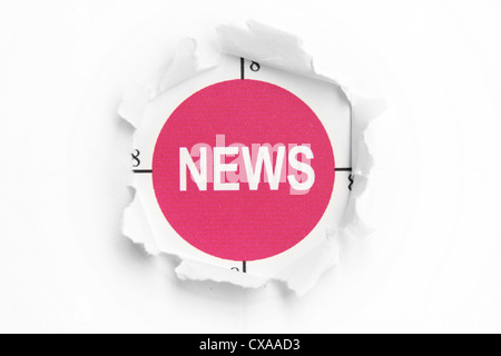 News text on paper hole Stock Photo