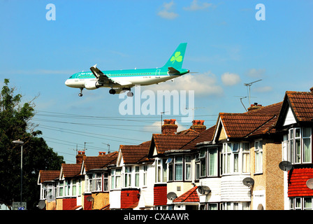 Passenger jet aircraft landing at Heathrow,London Stock Photo