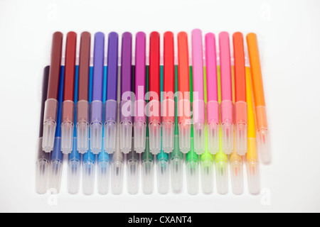 Pile of mixed coloured felt tipped pens with caps Stock Photo