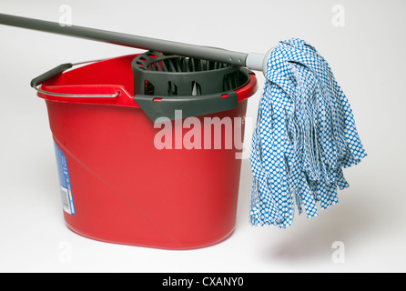 Red mop bucket and mop Stock Photo