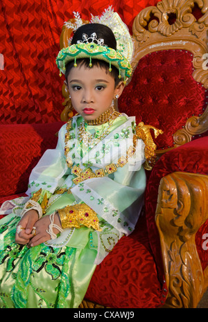 Young boy pausing during his noviciation ceremony, Taungyi, Shan State, Myanmar (Burma), Asia Stock Photo