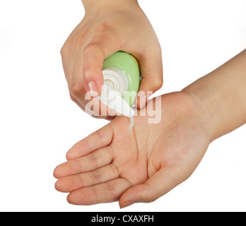 Woman applying liquid soap on her hand, white background Stock Photo