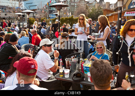 Visitors enjoying apres ski at an outdoor patio, Whistler Blackcomb Ski Resort, Whistler, British Columbia, Canada Stock Photo