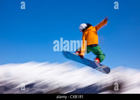 Snowboarder flying off a ramp, Whistler Mountain, Whistler Blackcomb Ski Resort, Whistler, British Columbia, Canada Stock Photo