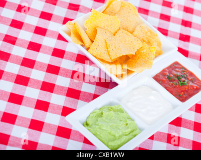 Three Mexican dips and tortilla chips Stock Photo