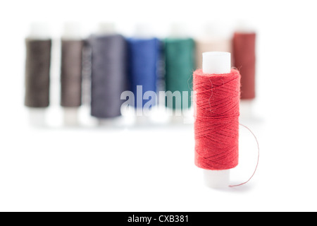 different colors thread spools isolated on white background Stock Photo ...