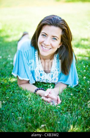 Pretty brunette adult woman portrait smiling outside Stock Photo