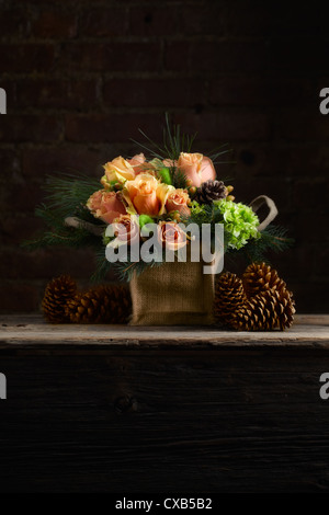 Rose, Hydrangea, Hypericum, Douglas Fir and Pine Flower Arrangement Stock Photo