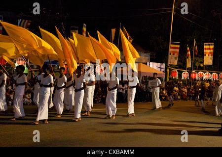 Yellow flag-bearers in the Navam Maha Perahera, Colombo, Sri Lanka, Asia Stock Photo