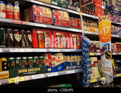shelves full of beer in a tesco store, uk Stock Photo