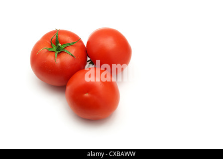 Three isolated tomatoes. Element of design. Stock Photo