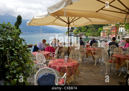 Lakeside view of cafe in the medieval village of Varenna, Lake Como, Lombardy, Italian Lakes, Italy, Europe Stock Photo