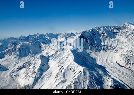 The Denali National Park in Alaska offers beautiful mountain and glacier scenery from the air. Stock Photo