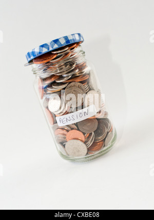 A glass jar of money with 'pension' label. Stock Photo