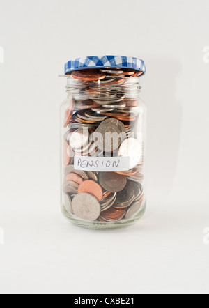 A glass jar of money with 'pension' label. Stock Photo