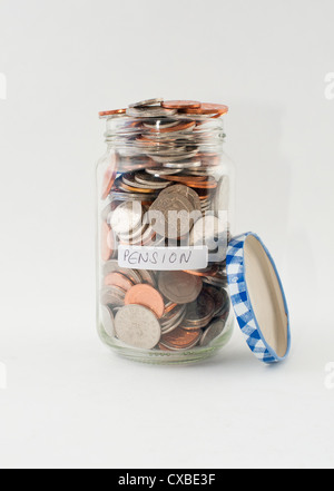 A glass jar of money with 'pension' label. Stock Photo