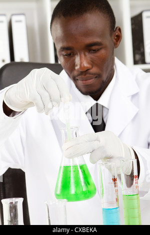 african american male scientist doing experiment Stock Photo