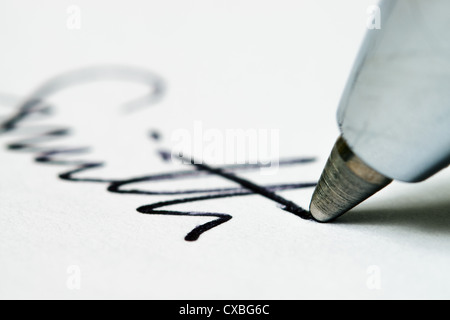 Close up of ball point pen nib and text Stock Photo