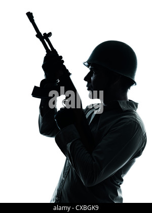 Portrait Of A Mature Soldier Aiming With Gun Over Black Background ...
