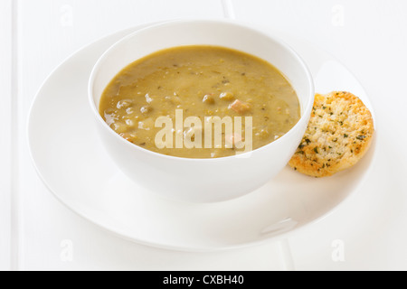 Small meal of half a can of pea and ham soup with one garlic toast. Total calories 180, or 754 kilojoules. Stock Photo