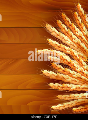 Ears of wheat on wooden background. Stock Photo